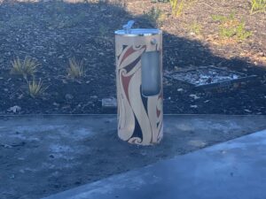 Classic Round Fountain with bottle filler and custom Māori mural.